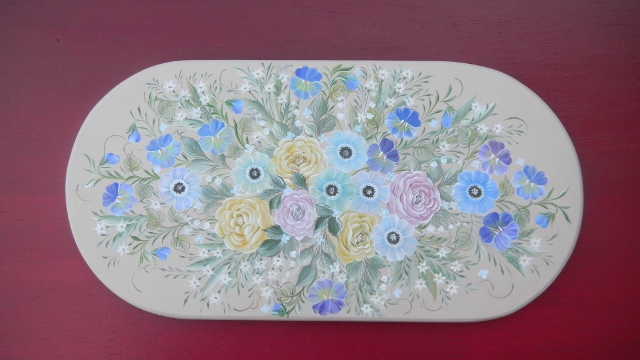 画像: 微細な色合いの花々が咲いたアイアンバスケット